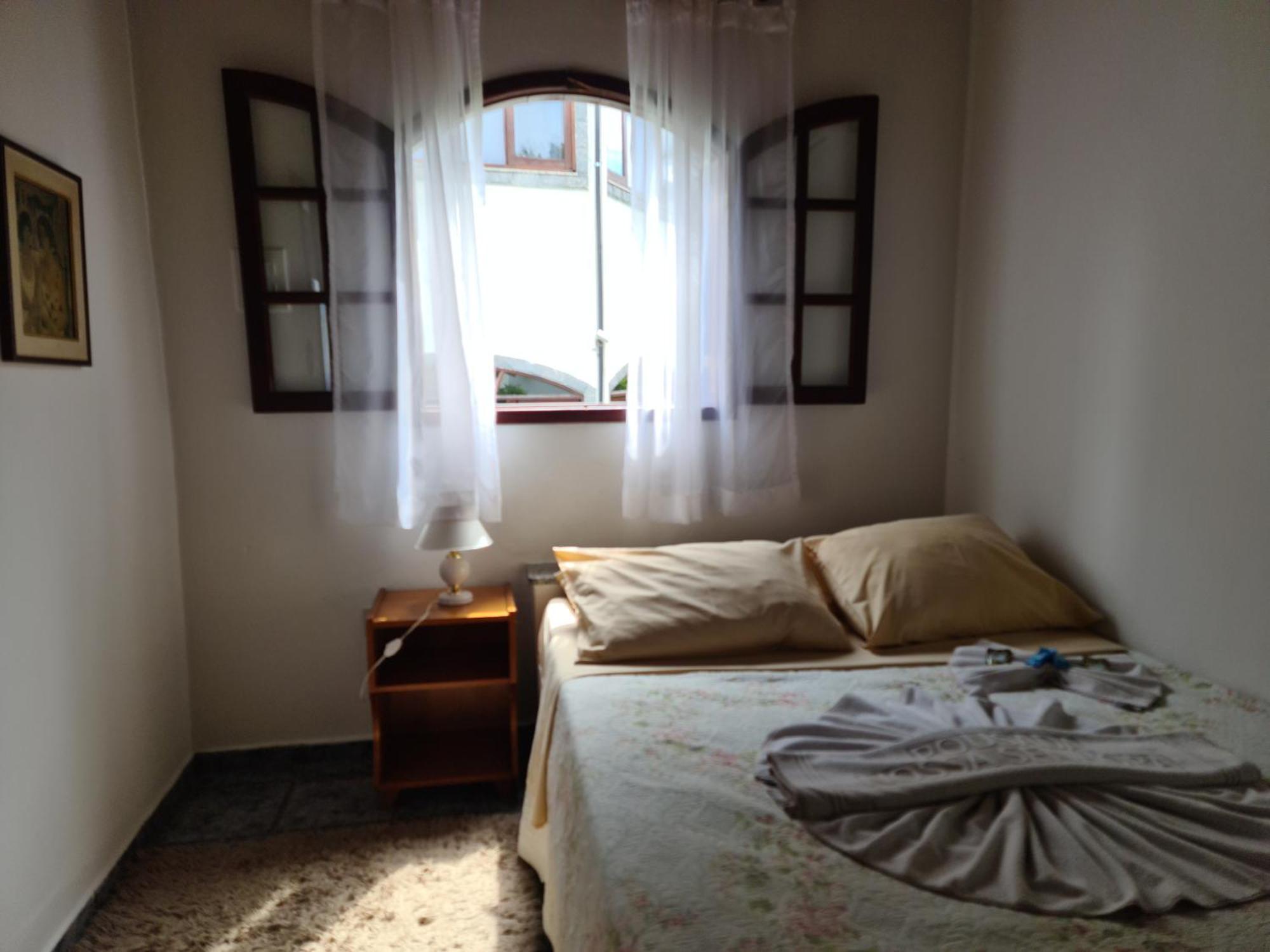 Pousada Nossa Senhora Penedo  Room photo A bedroom in a hotel in Brazil