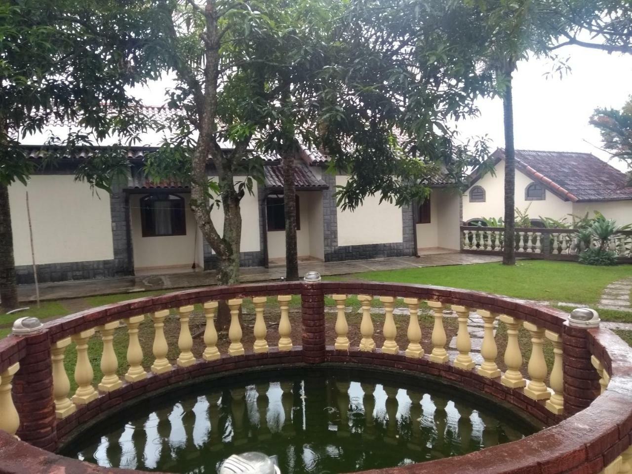 Pousada Nossa Senhora Penedo  Exterior photo The fountain at the front of the house